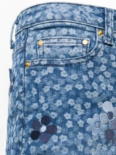 Shop Michael Michael Kors Floral Printed Flared Jeans In Blue