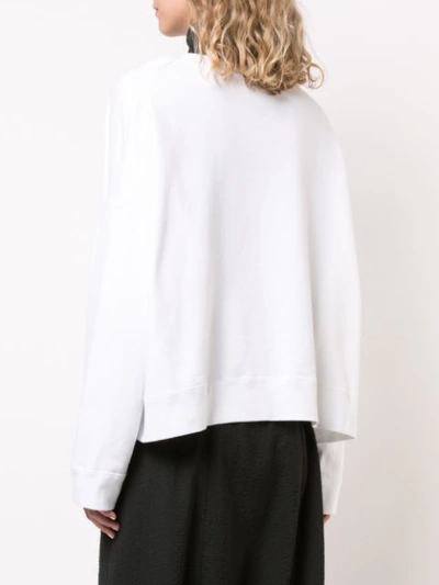 Shop Undercover Embroidered Curved Hem Sweatshirt In White