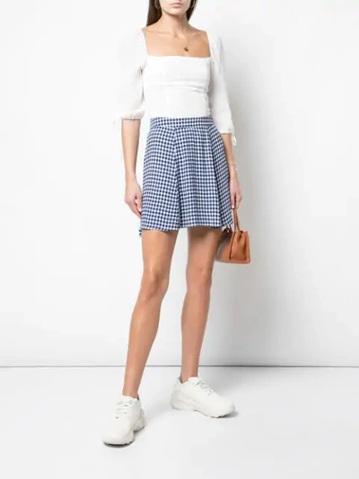 Shop Reformation Check Print Flounce Skirt In Blue