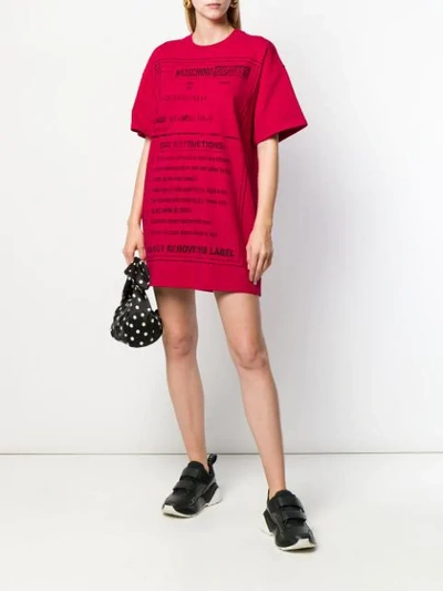 Shop Moschino Care Instructions T-shirt Dress In Red