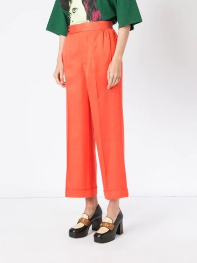 Shop Undercover Flared High-waisted Trousers - Orange