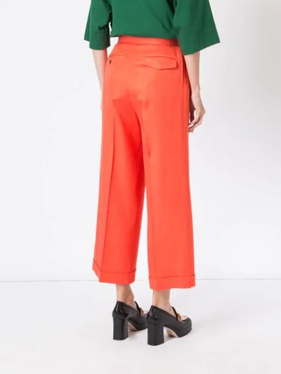 Shop Undercover Flared High-waisted Trousers - Orange