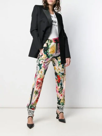 Shop Dolce & Gabbana Floral Print Trousers In Black