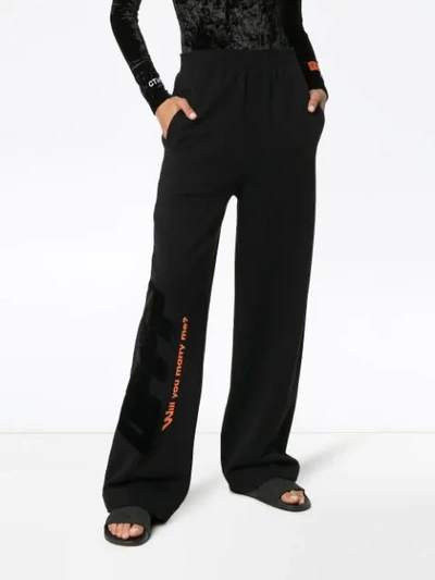 Shop Off-white High Waisted Text Print Cotton Trousers In Black