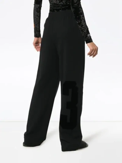 Shop Off-white High Waisted Text Print Cotton Trousers In Black