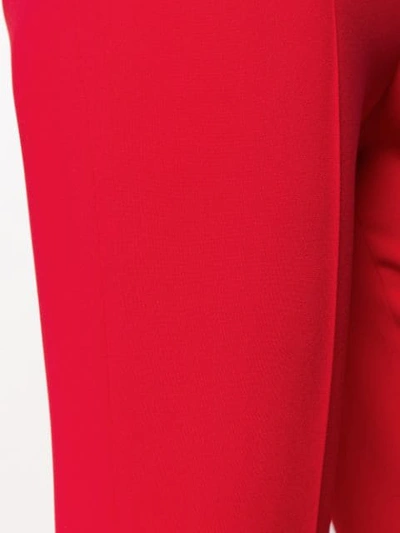Shop Miu Miu Flared High Rise Trousers In Red