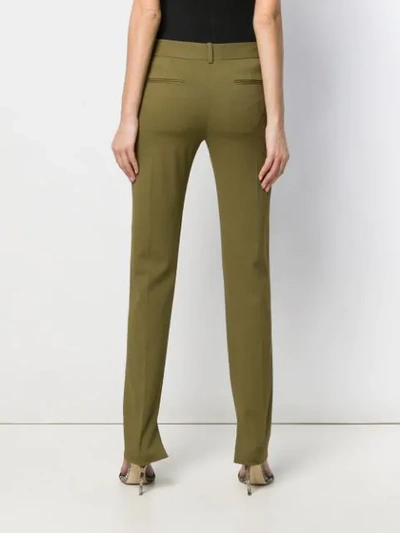 Shop Victoria Beckham Side Split Skinny Trousers In Green