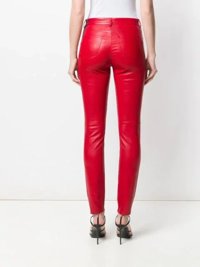 Shop Saint Laurent Slim-fit Leather Trousers In Red