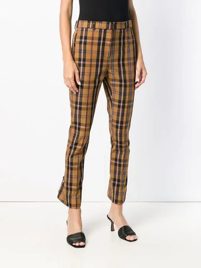 Shop Rokh Checked Kick Flare Trousers In Brown