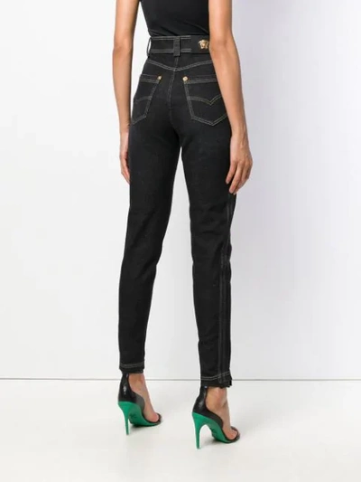 Shop Versace High-waisted Slim Jeans - Black