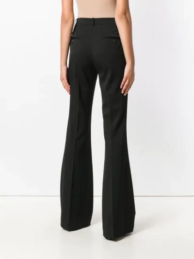 Shop Michael Kors Collection High-waisted Flared Trousers - Black