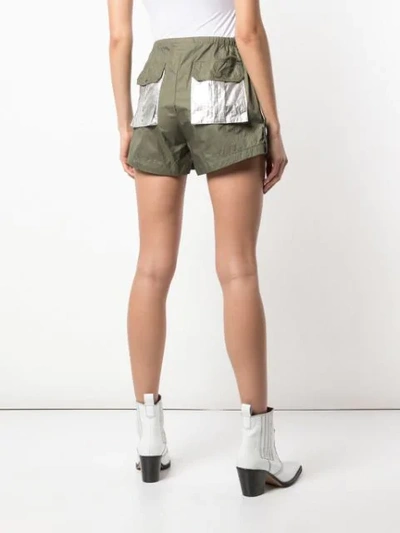 Shop Ganni Two Way Tech Shorts In Green