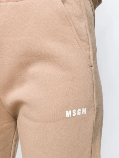 Shop Msgm Logo Print Track Pants In Neutrals