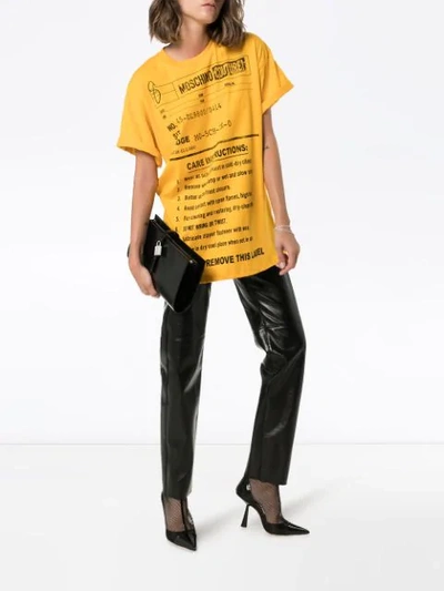 Shop Moschino Oversized Care Label-print T-shirt In Yellow