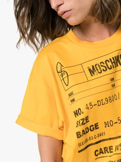 Shop Moschino Oversized Care Label-print T-shirt In Yellow