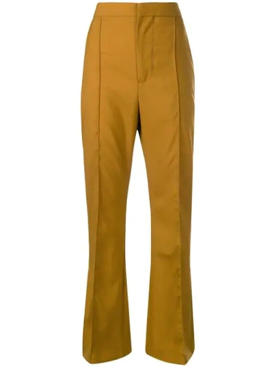 Shop Marni Flared Trousers In Yellow