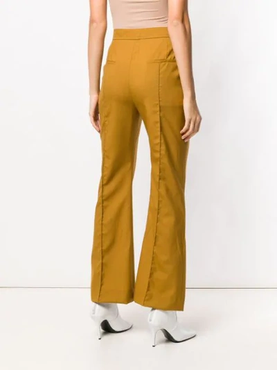 Shop Marni Flared Trousers In Yellow