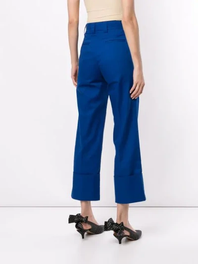 Shop Msgm Pleated Cuffed Trousers In Blue