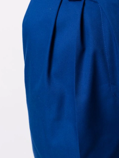 Shop Msgm Pleated Cuffed Trousers In Blue