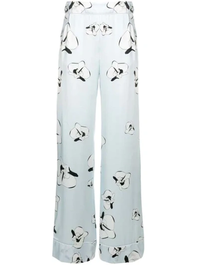 Shop Genny Floral Print Trousers In Blue