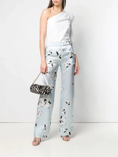 Shop Genny Floral Print Trousers In Blue
