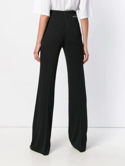 Shop Prada Ribbed Flared Tailored Trousers In Black