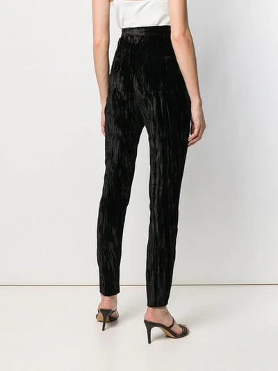 Shop Saint Laurent Wrinkled Effect Trousers In Black