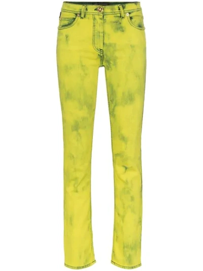 Shop Versace Acid Wash Logo Label Skinny Jeans In Yellow