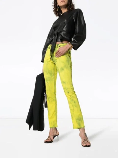 Shop Versace Acid Wash Logo Label Skinny Jeans In Yellow