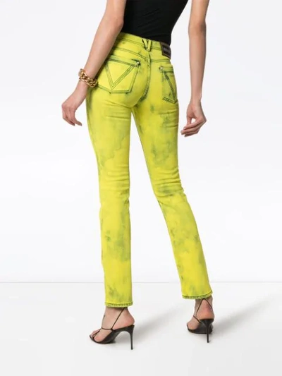 Shop Versace Acid Wash Logo Label Skinny Jeans In Yellow