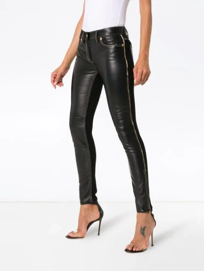 Shop Versace Slim Fit Trousers In Black