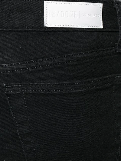 Shop Re/done Mid Rise Kick Flare Jeans In Black