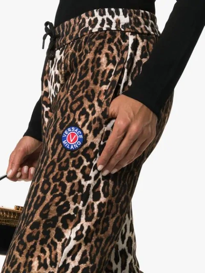 Shop Versace Leopard Print Joggers In A7008 Multicolor
