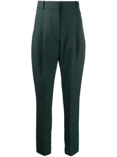 Shop Acne Studios Pleated Tapered Trousers In Green