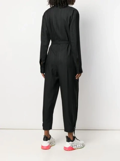 Shop Stella Mccartney Zipped Striped Jumpsuit In Black