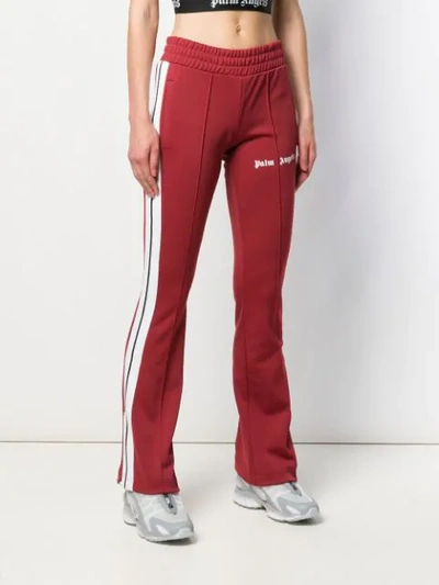 Shop Palm Angels Stripe Detail Track Pants In Red