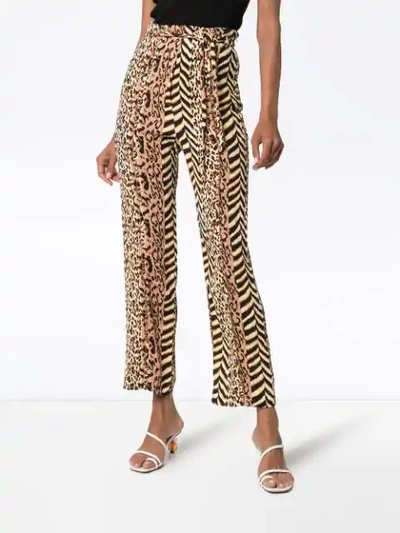 Shop Nanushka Luma Animal-print Trousers In Brown