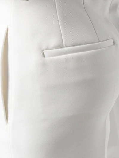 Shop Jil Sander High-waisted Flared Trousers In White