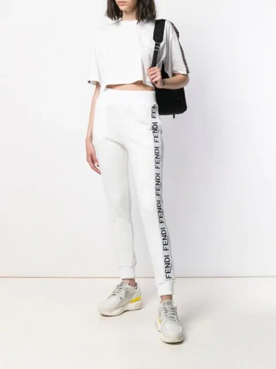 Shop Fendi Tapered Track Style Trousers In White