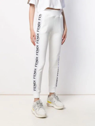 Shop Fendi Tapered Track Style Trousers In White