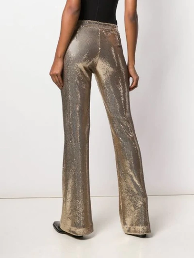 Shop Ainea Flared Sequin Trousers In Gold