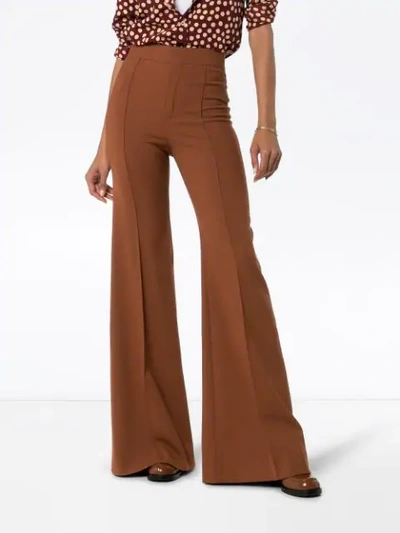 Shop Chloé High-waisted Flared Trousers In Brown