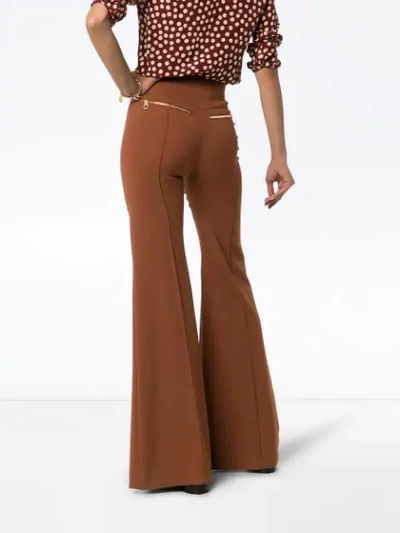 Shop Chloé High-waisted Flared Trousers In Brown