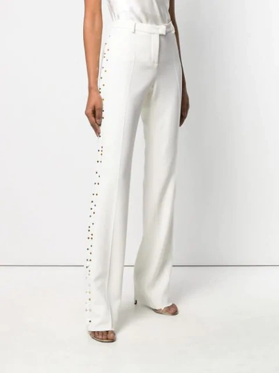 Shop Roberto Cavalli Mirror Snake Flared Trousers In White