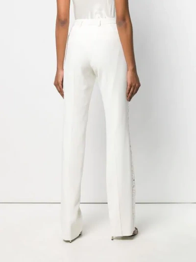 Shop Roberto Cavalli Mirror Snake Flared Trousers In White