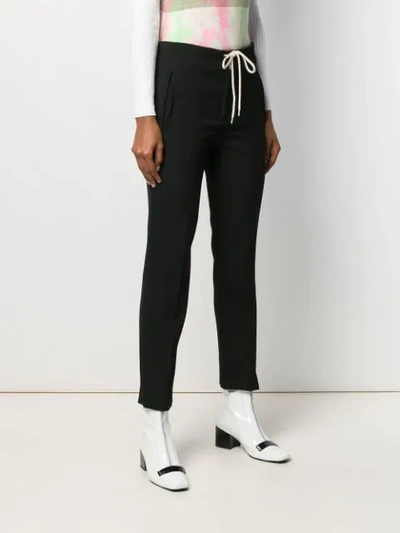 Shop Courrèges Cropped Trousers In Black