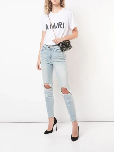 Shop Amiri Ripped Skinny Jeans In Blue