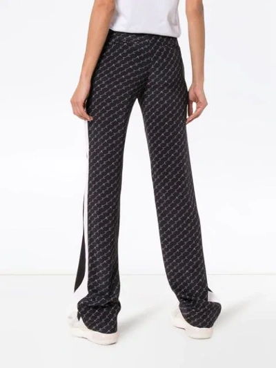 Shop Stella Mccartney Logo Print Wide Leg Trousers In Blue