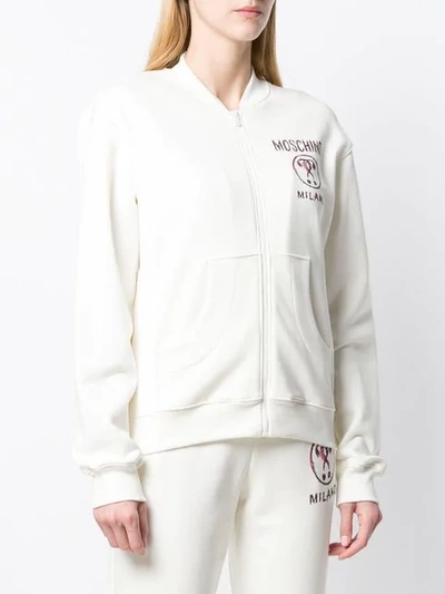 Shop Moschino Logo Print Bomber Jacket In White