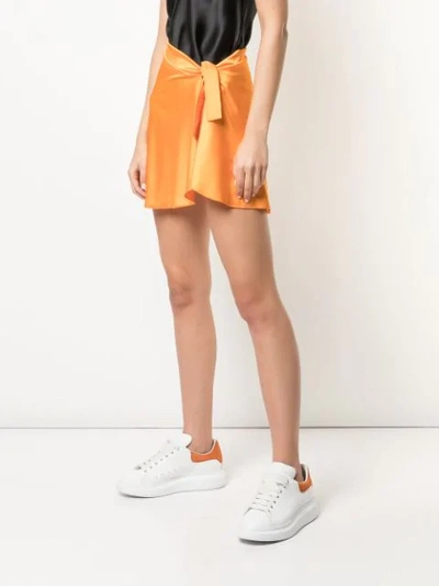 Shop Fantabody Wrap Mini Skirt In Orange